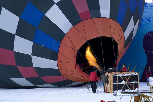 SWITZERLAND, Canton de Vaud, Chateau d Oex Flame being directed into inflated Hot Air