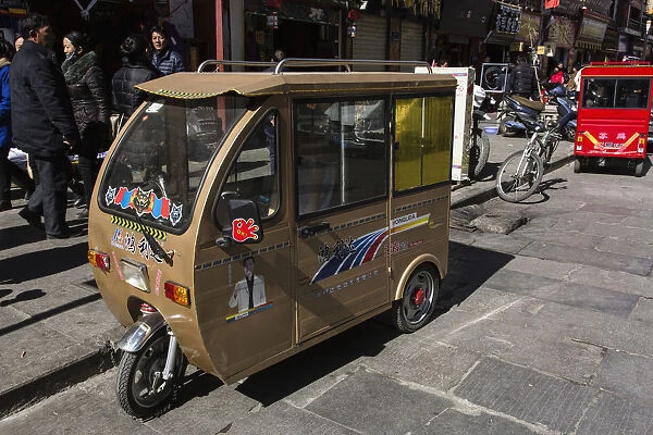 A tiny enclosed auto rickshaw in Lhasa, Tibet