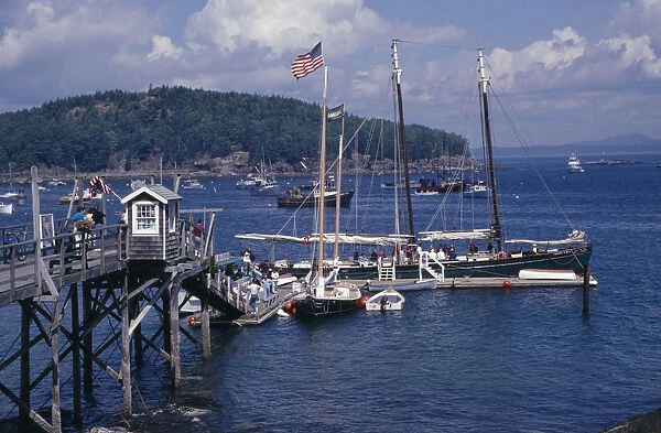 USA, Maine, Bar Harbour Wooden jetty with yacht moored at side