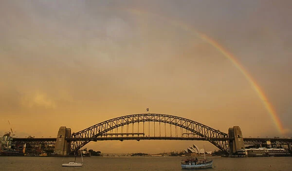Evening rainbow sets above the Sydney Harbour Bridge