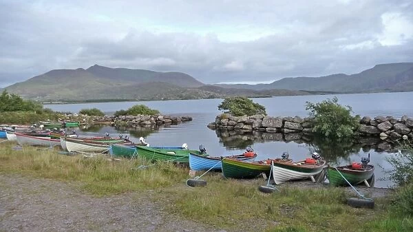Fishing boats moored on shore of freshwater lake, Lough Currane, County Kerry, Southwest Ireland, september