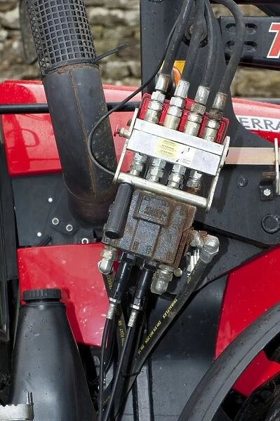 Quick release hydralic bracket on tractor for powering loader, England, october