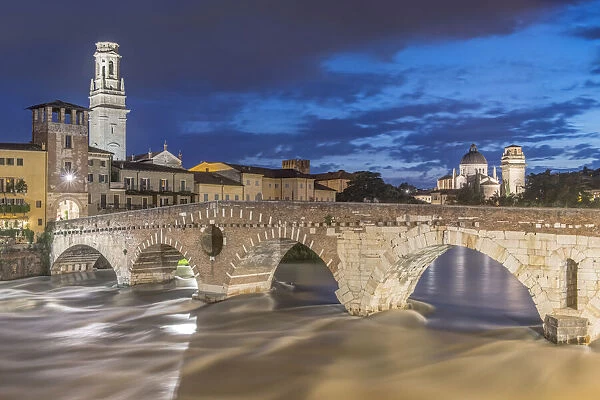 Italy, Verona. Ponte Pietra (Roman Bridge) at Twilight