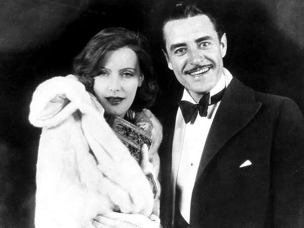 GARBO AND GILBERT, 1927. Greta Garbo and John Gilbert enjoying Hollywood night life, c1927