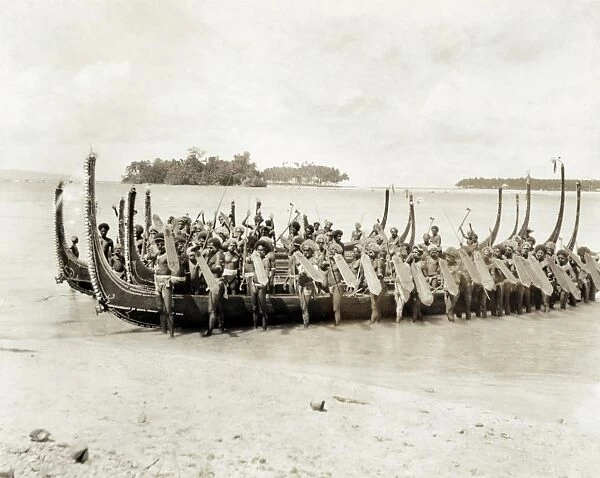 WARRIOR CANOE, c1922. A group of warriors with shields and spears standing by canoes
