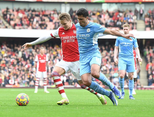 Arsenal's Martin Odegaard Clashes with Manchester City's Rodri: A Premier League Showdown at Emirates Stadium