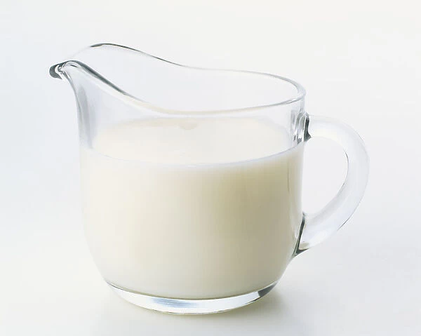 Clear glass jug of low-fat milk