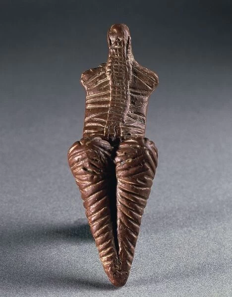 Decorated terracotta statuette of female figure, rear view