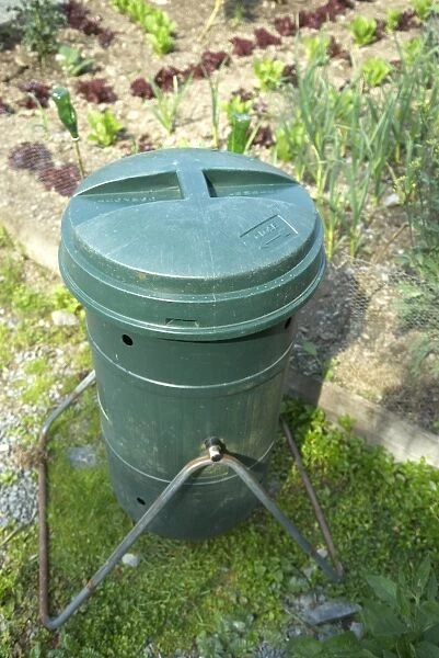 Green plastic compost bin, with lid