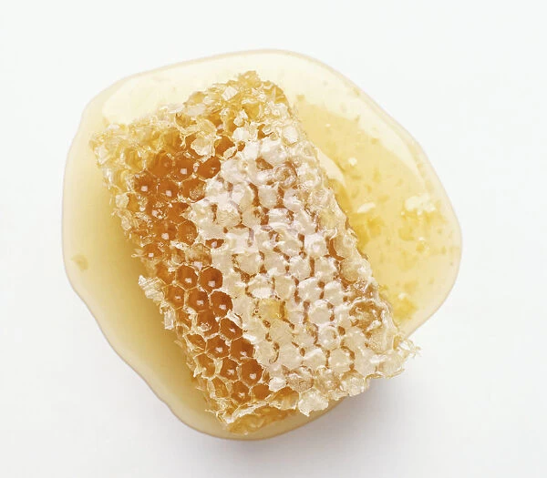 Honeycomb dripping with honey, close up
