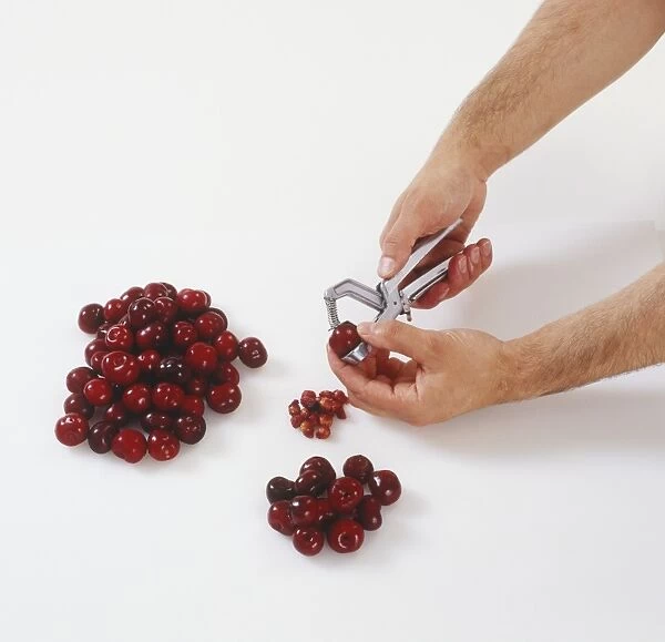 Person stoning cherries
