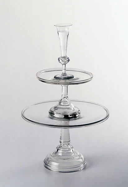 A tiered cake stand made of glass