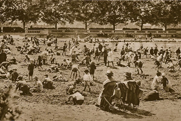 The beach without a sea: building sand-castles, Bishops Park (sepia photo)