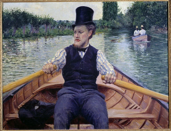 Part of the boat. A man wearing a tall hat rowing in a boat