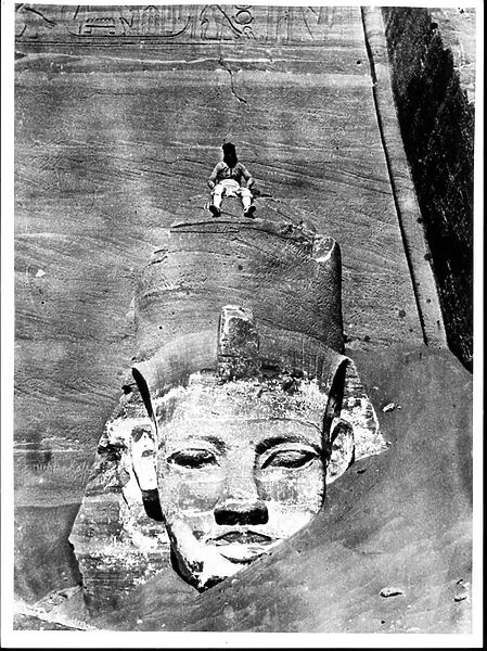 Egyptian Seated on a Colossal Figure of the King, from the Great Temple of Ramesses II in
