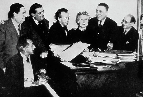 The 'Groupe des Six' with Jean Cocteau (piano) : l-r : Darius Milhaud, Georges Auric, Arthur Honegger, Germaine Tailleferre, Francis Poulenc and Louis Durey