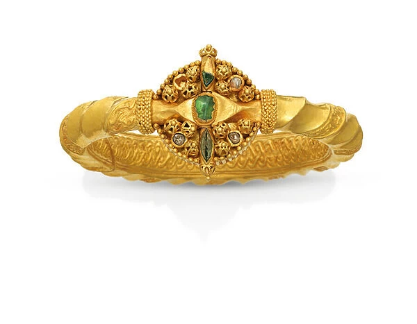 A rare Fatimid armlet, Syrian or Egyptian (gold with emerald & glass)