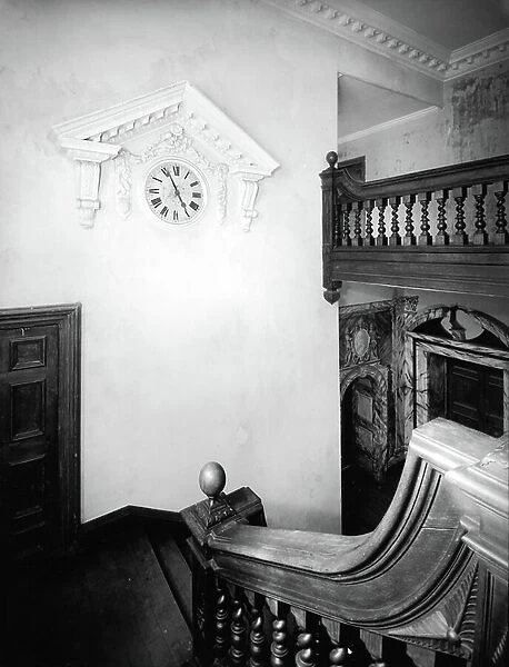 The staircase at Dunsland House, Devon, from England's Lost Houses by Giles Worsley (1961-2006) published 2002 (b / w photo)