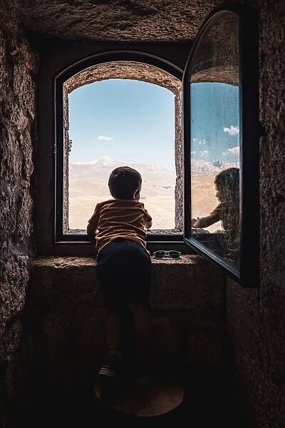 Little boy at the window