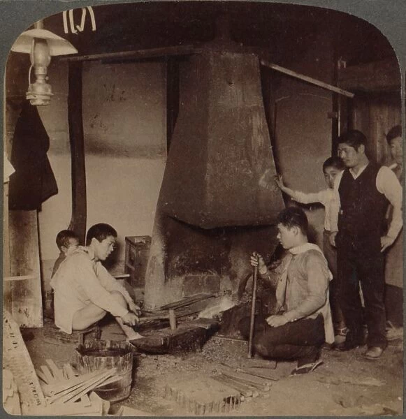 A Japanese blacksmith at his forge, Yokohama, Japan, 1904