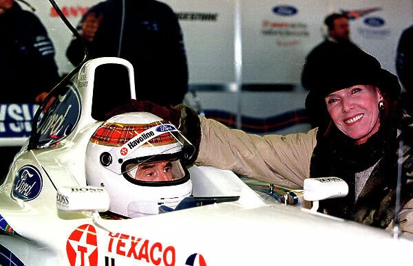 SILVERSTONE 31ST OCTOBER 1997 JACKIE STEWART, BOSS OF THE STEWART FORD GRAND PRIX TEAM ABOUT TO TRY ONE HIS TEAM'S GRAND PRIX CARS AT THE SILVERSTONE TRACK NEAR NORTHAMPTON. SEEN HERE WITH HIS WIFE HELEN. JACKIE