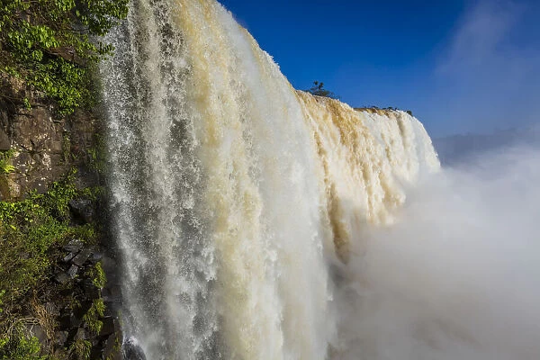 Close-up of waterfall cascading over edge, scenic view of Iguacu Falls, Iguacu National Park, Parana, Brazil