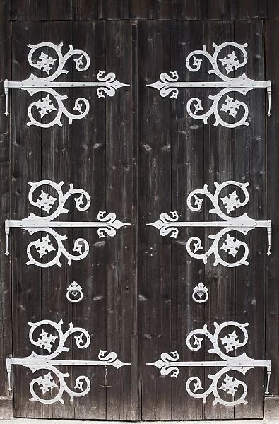 Large Metal Decorative Hinges On A Weathered Wooden Barn Door; Fussen, Germany