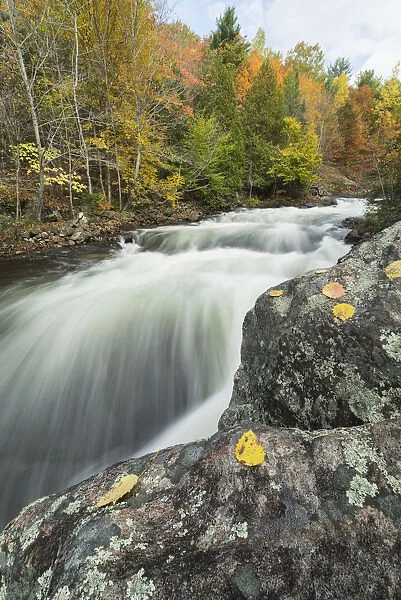 Long Exposure Of Water Flowing Down Kawagama Falls In The Autumn, Near Dorset; Ontario, Canada