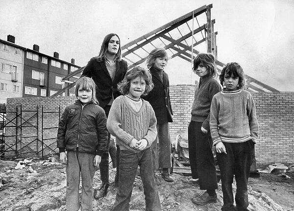 Children standing guard over The Big Lamp youth club which is now under construction in