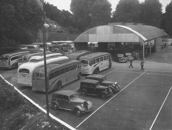 Coaches and cars mingle in the Lymington Road coach station, Torquay, in August 1951