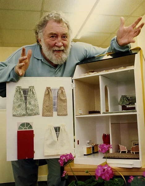 David Bellamy inspects the energy efficient dolls house on show at the Newcastle Energy