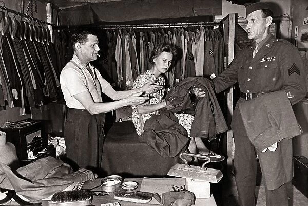 Mr. W. P. Worthy and his wife iron clothes for American troops in the West Country village