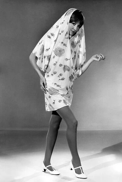 Reveille Fashions 1966: Anne Powell modelling summer dress come shower coat