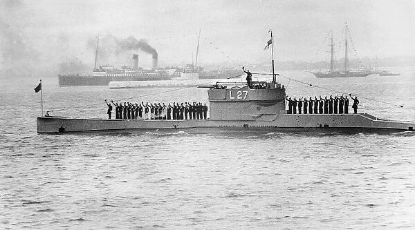 Royal Navy submarine L27 give a salute from its crew at the Coronation review at