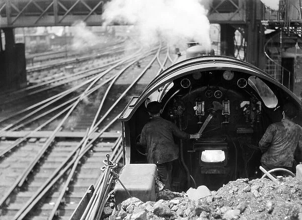 View over the cab of a Southern railways express train making its way from Waterloo to