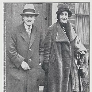 Agatha Christie and husband, reportage photograph on doorstep. From an article, Up the Rebels! - And Others'by Ericus. With description, Mrs M E Mallowan, better known as Agatha Christie, the novelist and playwright