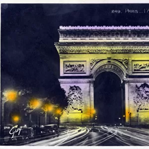 The Arc de Triomphe, Paris, France - photographed at night. Date: circa 1930s