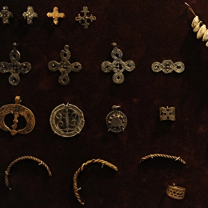 Crosses of bronze and tin and bronze pendants. Museum of His