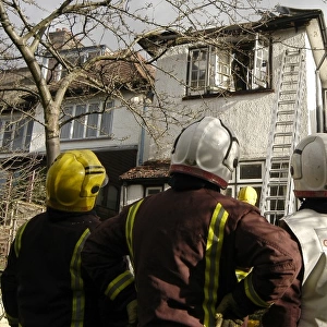 Firefighters dealing with a house fire