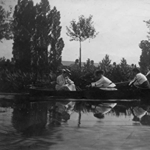 Three students rowing