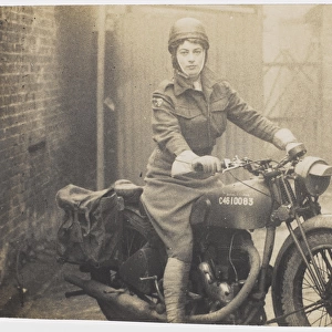 Valerie Ryshworth-Hill in ATS uniform on a motorbike
