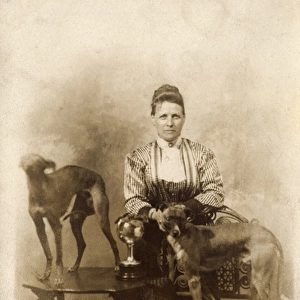 Woman with two greyhounds