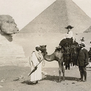 Woman riding a camel in Giza, Egypt