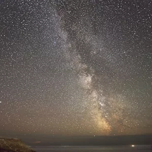 An autumn view of the Milky Way over the Atlantic Ocean, seen from the cliffs of Land's End, the most southwesterly point of Great Britain, Cornwall, England, United Kingdom, Europe