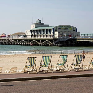 Deckchairs, beach and pier, Bournemouth, Dorset, England, United Kingdom, Europe