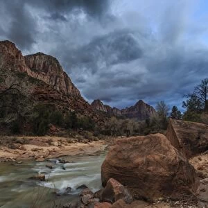 Dusk beside the Virgin River under a threatening sky in winter, Zion National Park, Utah, United States of America, North America