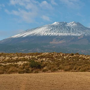 First snow covering the summit of Mount Etna volcano seen from inland, UNESCO World Heritage Site, Etna Park, Catania province, Sicily, Italy, Mediterranean, Europe