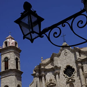 Historic church behind the silhouette of an iron lantern, Old Havana, Cuba, West Indies