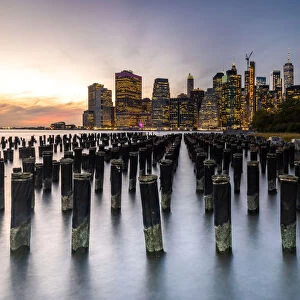 Long exposure of the lights of Lower Manhattan during sunset as seen from Brooklyn Bridge Park