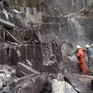 Pneumatic drilling of blast hole, Nantlle Slate Quarry, Snowdonia, north Wales